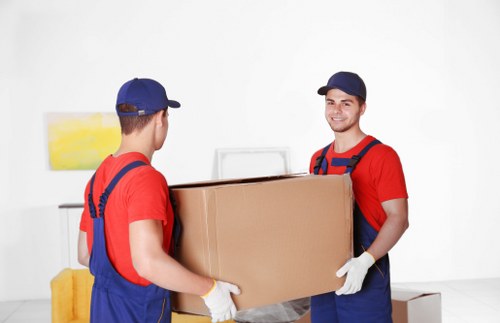 Mover carrying furniture near Paddington apartments