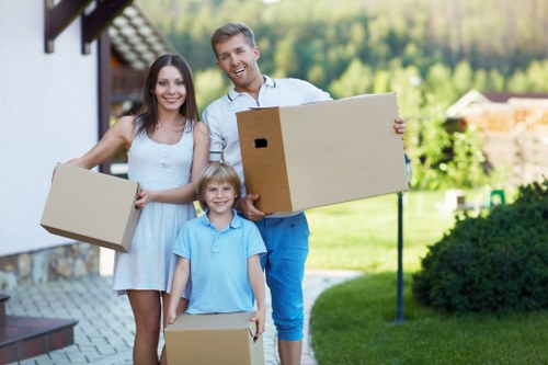 Moving team handling boxes and furniture for a Paddington home relocation