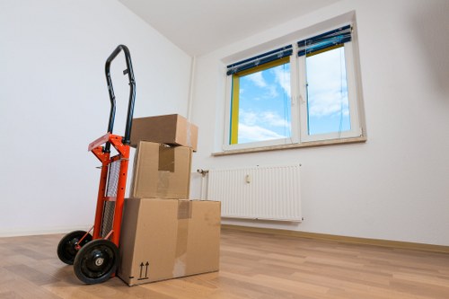 Movers handling furniture near Paddington apartment building